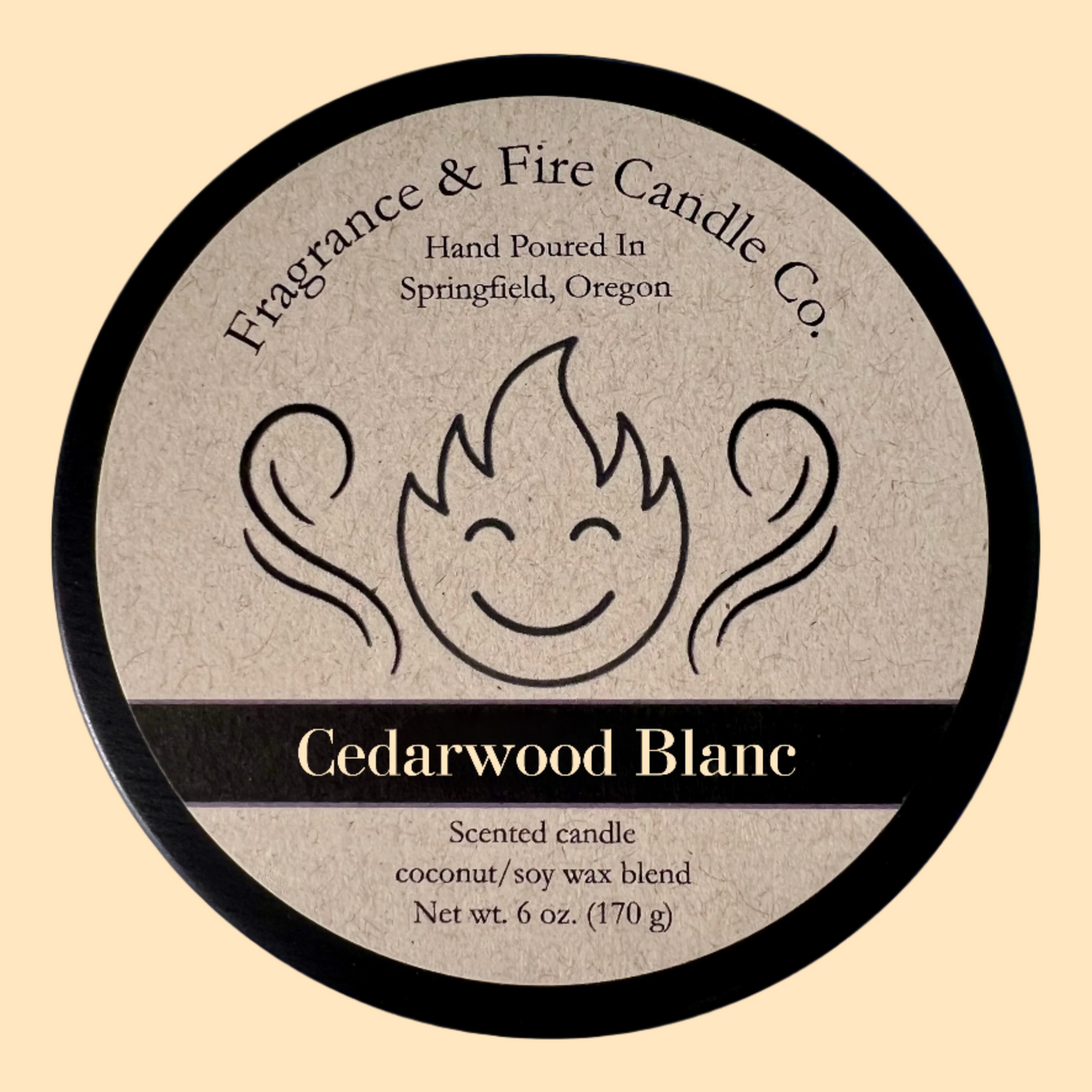 Cream colored background with round candle top and brown label. The candles name is Cedarwood Blanc.