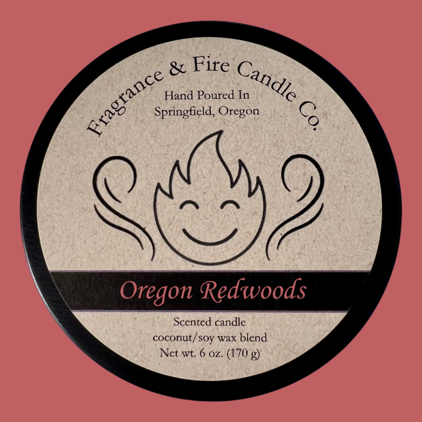 Burnt orange colored background with round candle top and brown label. Name of the candle on the label is Oregon Redwoods.