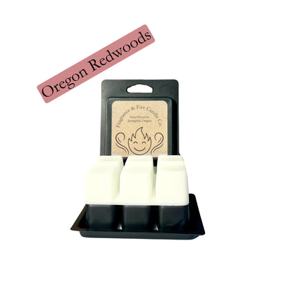 Fragrance & Fire Oregon Redwoods wax melts. Black container with brown label showing comapny logo. White melts are displayed sitting on container.