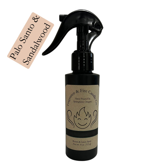 Fragrance & Fire Palo Santo & Sandalwood room & linen spray. Sleek black bottle with brown label showing company logo.