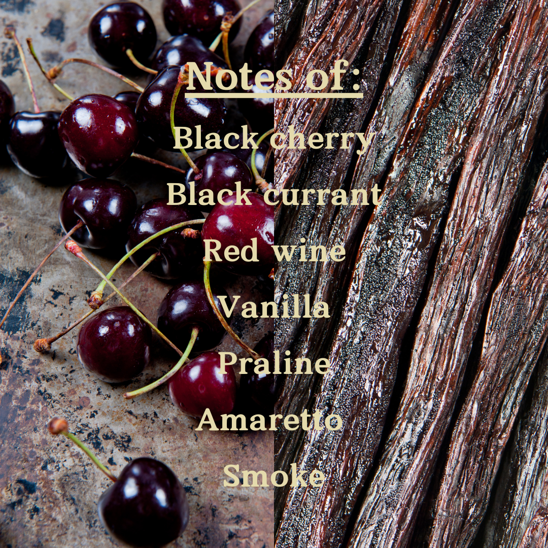 Background of black cherries and vanilla with scent notes listed as Black cherry, Black currant, Red wine, vanilla, praline, amaretto, smoke.